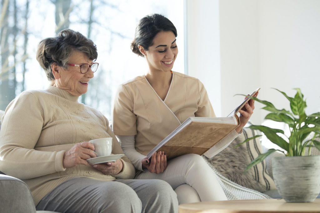 Caregiver with client reading