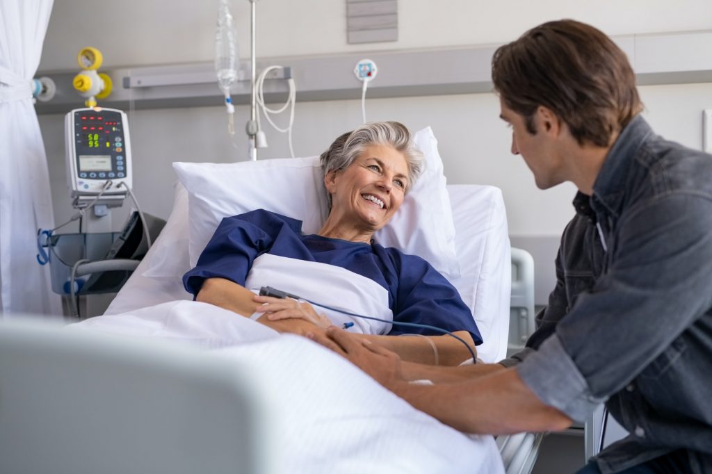 Caregiver with client in hospital